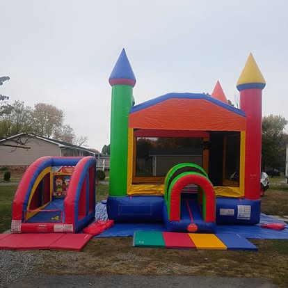 Colorful castle bounce house combo with slide
